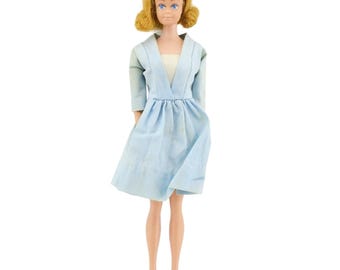 Mattel Midge 1968 barbie doll number 860 in original clothes. Flipped blonde hair, blue dress. Made in USA.