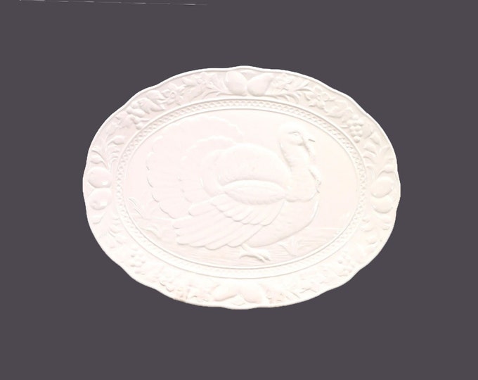 All-white JAP22 large oval turkey platter. Central image of His Majesty, the turkey. Embossed fruit, veggies made in Japan.