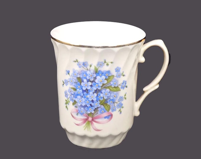 Crown Regent tea mug. Blue anemones, pink ribbons, gold edge. Made in Romania.