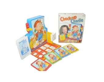 Check-Up Charlie board game published by Milton Bradley. Complete.