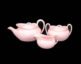 Wedgwood Alpine Pink Embossed four-cup tea pot, creamer and covered sugar bowl made in England.