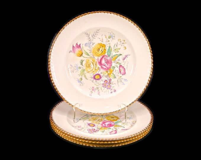Four British Empire Ware Breath O' Spring dinner plates. Flaws (see below).