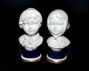 Pair of mid century Capodimonte white porcelain bisque busts | figurines. Girl in bonnet boy in cap. Made in Italy. Attributed to Pucci.