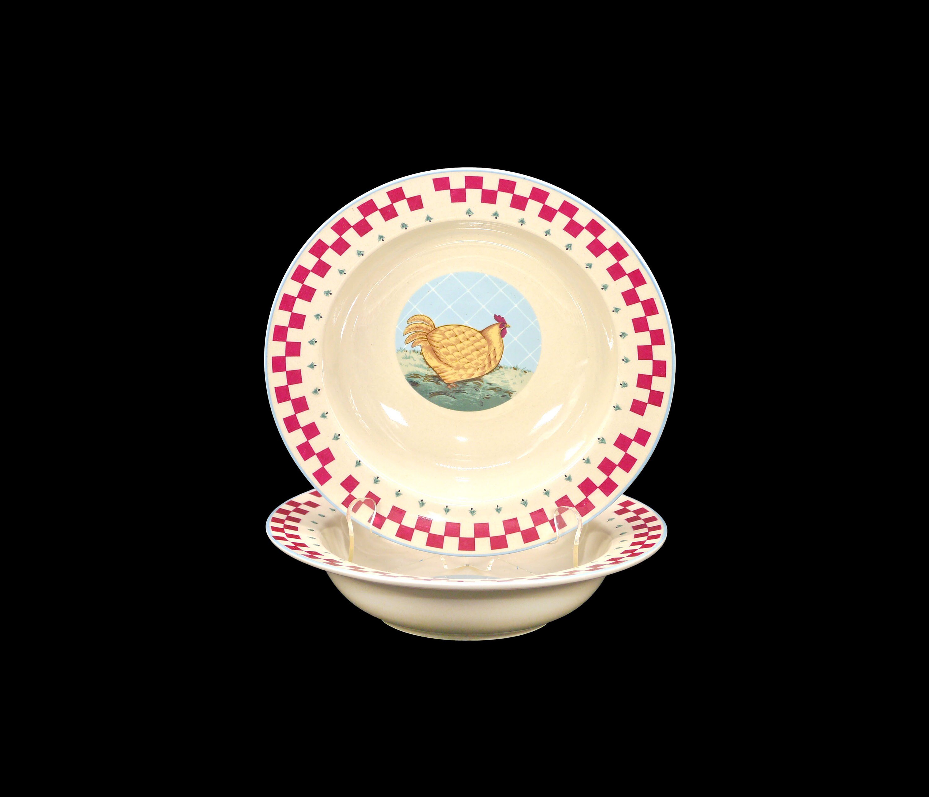 Pair of Tienshan Folk Art rimmed stoneware soup bowls. Chicken and pig in center respectively.