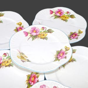 Six Shelley Begonia bone china bread, dessert plates in the dainty shape made in England.