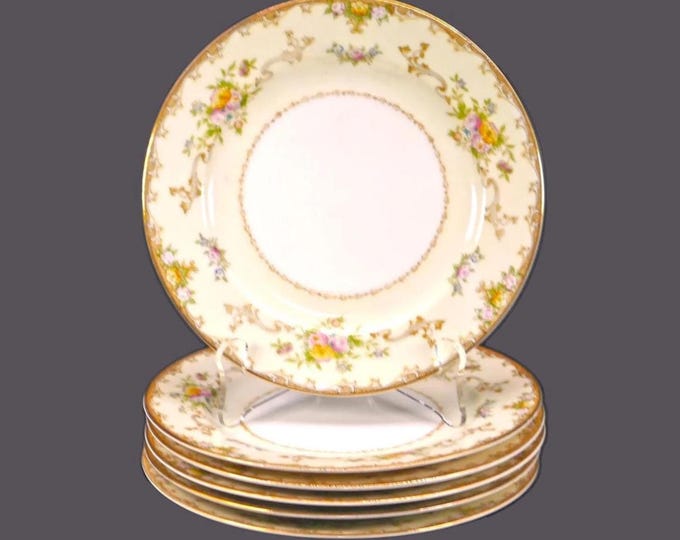 Six Meito hand-painted Nippon bread plates. Multicolor florals sprays, scrolls. Made in Japan.