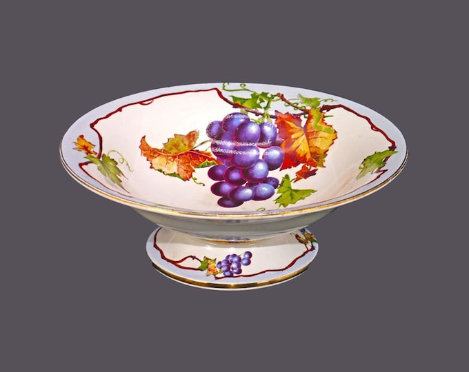 Compote | footed bowl marked 4572. Hand-painted grapes, leaves, branches, blue band, gold edge. Made in England. Flaws.