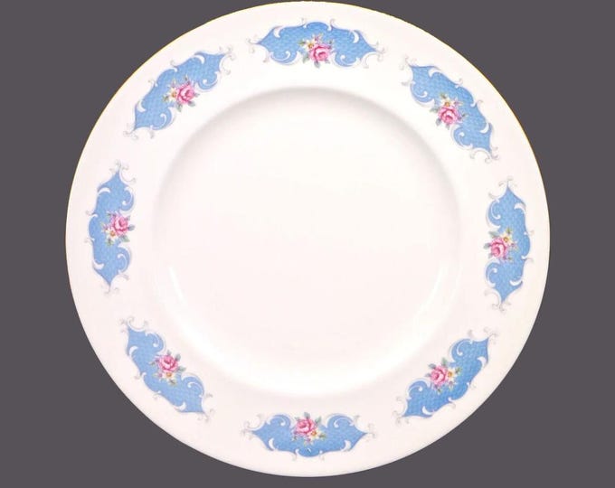 Royal Vale dinner plate. Pink roses blue cartouches gold edge. Made in England. Minor factory flaw (see below).