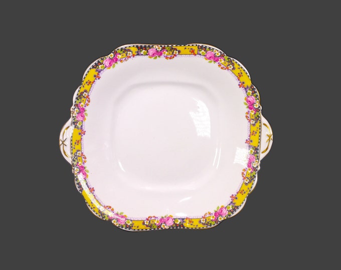 Antique art-nouveau period John Aynsley square, handled cake serving plate. Roses on yellow, black accents. Minor flaw (see below).