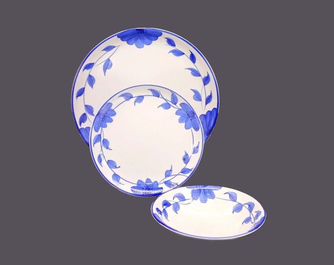Partial place setting Gibson Housewares Larkspur tableware. Blue leaves and flowers on white, blue trim. See details below.