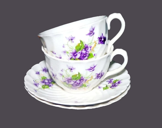 Pair of Arthur Wilkinson Royal Staffordshire cup and saucer sets. Bouquets of violets, greenery. Made in England.