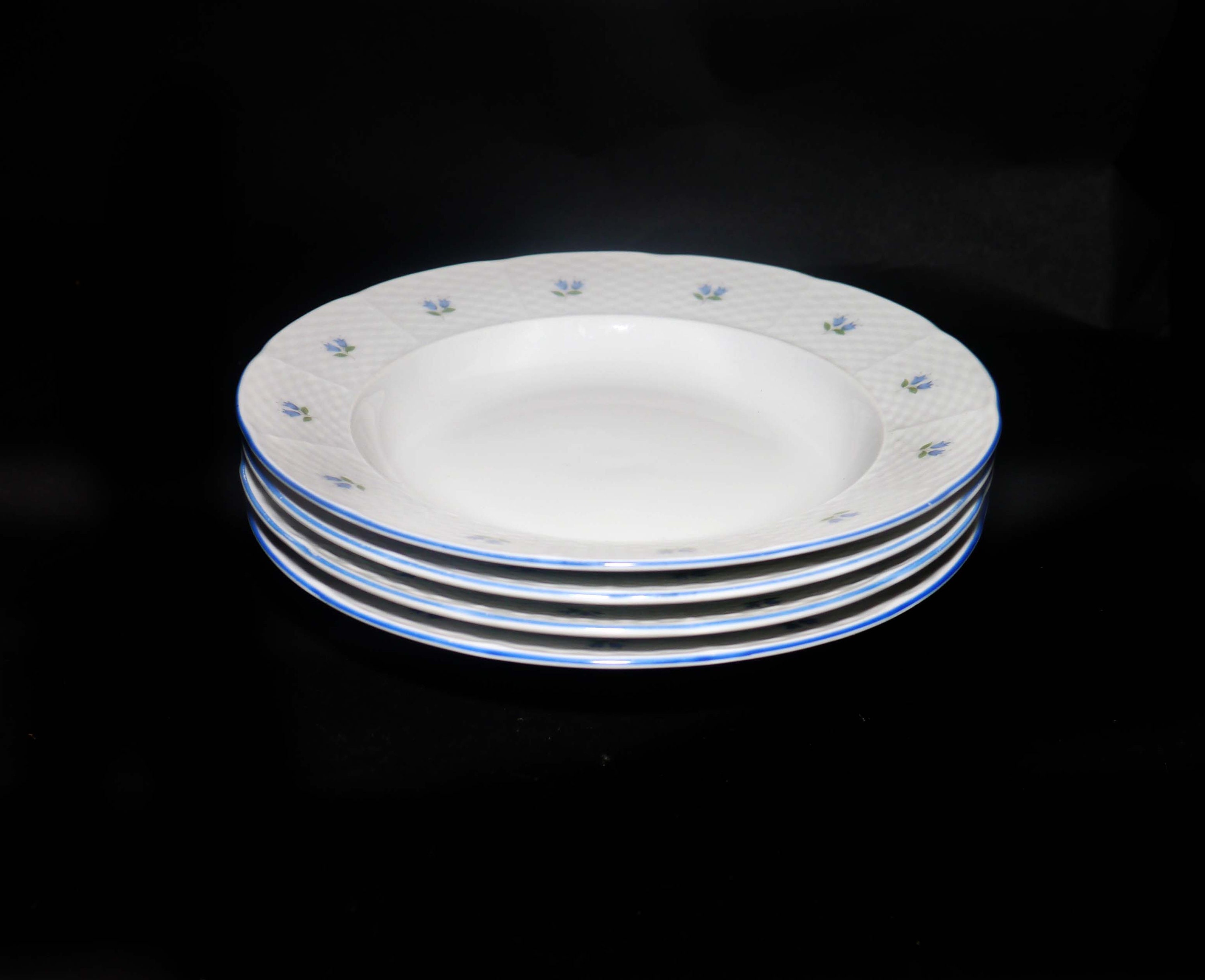 Four Belfor Blue Bell rimmed soup bowls made in Czechoslovakia for Birks.
