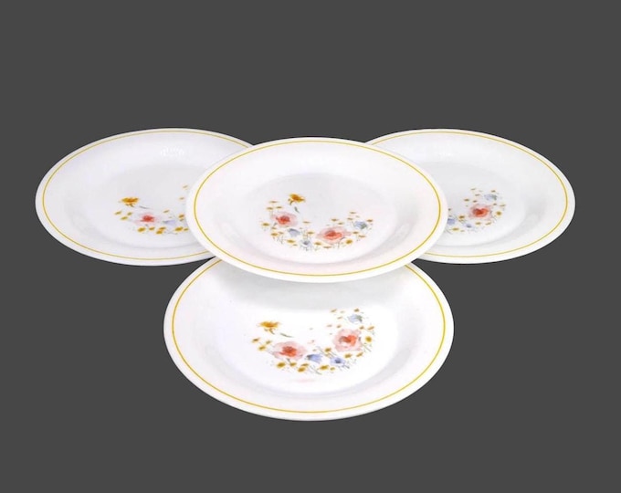 Four Arcopal ARP11 milk glass salad plates made in France.