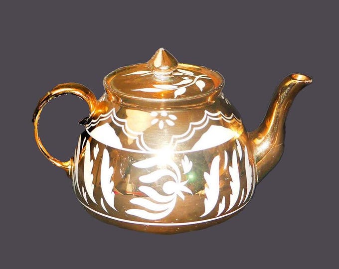 Gibsons W206 hand-decorated four-cup gold lusterware teapot with lid made in England.