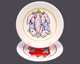 Pair of children's elephant plates. One pink elephant, one red elephant. Hand painted in Estonia by Laangoo.