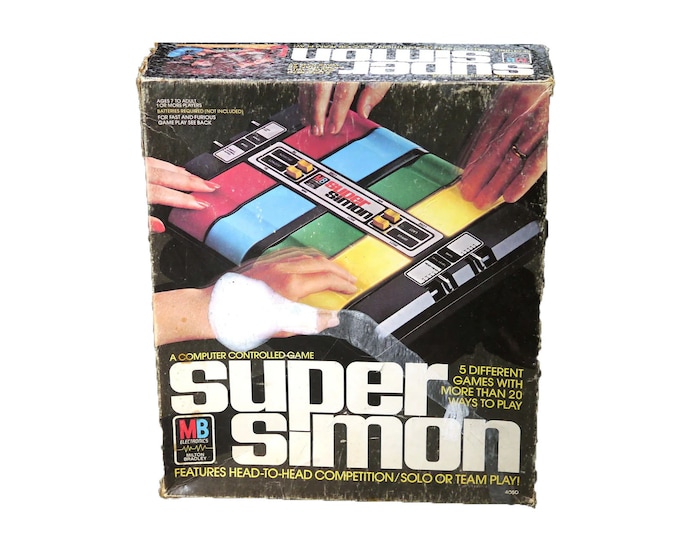 Super Simon electronic board game published 1979 Milton Bradley. Complete and working. Reproduced instruction sheets