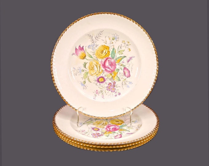 Four British Empire Ware Breath O' Spring dinner plates. Flaws (see below).