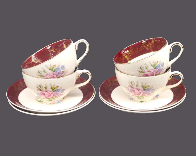 Four J&G Meakin cup and saucer sets made in England. Maroon and florals.