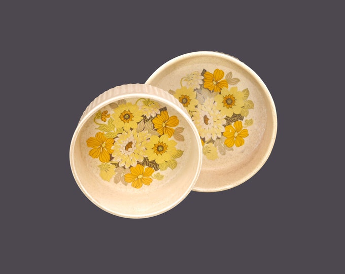 Pair of Ulster Ceramics round stoneware souffle or casserole dishes made in Ireland. Retro flower-power yellow and orange florals.