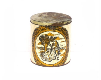 Biscuit tin for use as tea caddy or canister. Lithographed romance scene, detailed scrollwork. Attributed 1930s England.