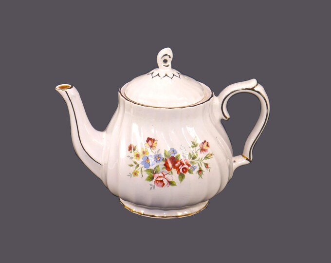 Sadler Windsor four-cup teapot. Roses and other multicolored flowers, gold edge and accents.
