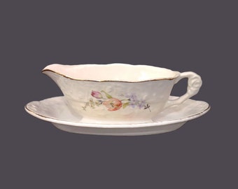 British Empire China Co. Haddon Hall Deluxe Embossed Ware gravy boat with oval under plate.