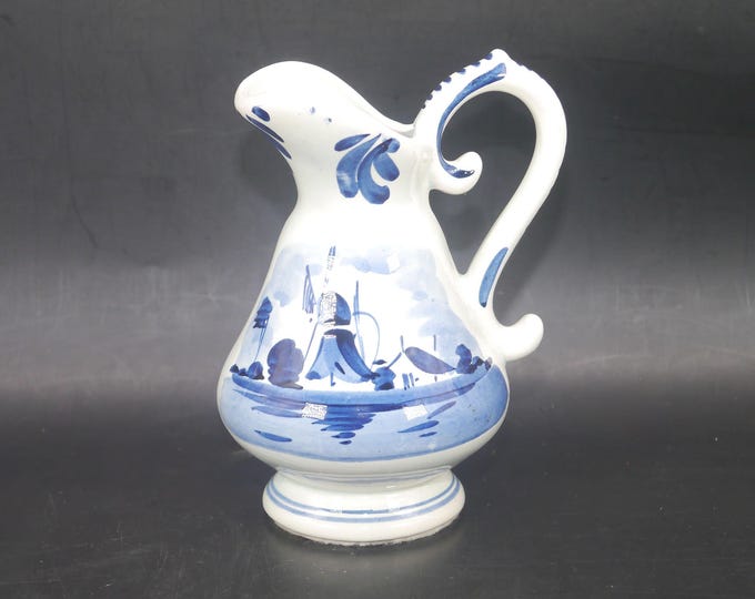 Hand-painted Delft jug made in Holland. Traditional Windmill and sailboat scene. Flaw (see below).