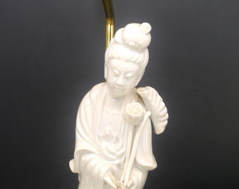 Mid-century Seyei blanc de chine geisha figural table lamp with fringed silk shade and Oriental finial. Made in Japan.