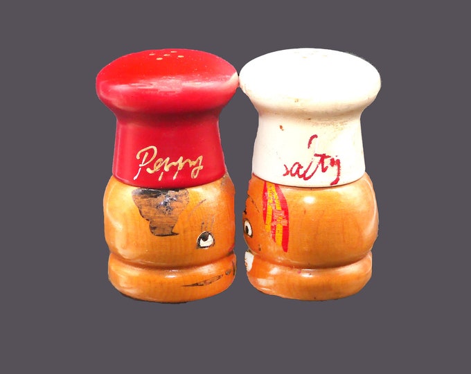 Mid-century Salty and Peppy hand-painted wooden salt and pepper shaker set. Chef's hat screws off to fill. Made in Japan.