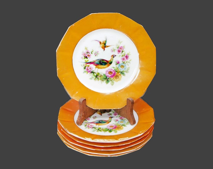 Six antique orange lusterware dessert plates. Peacocks and florals. Made in Germany. Flaws (see below).