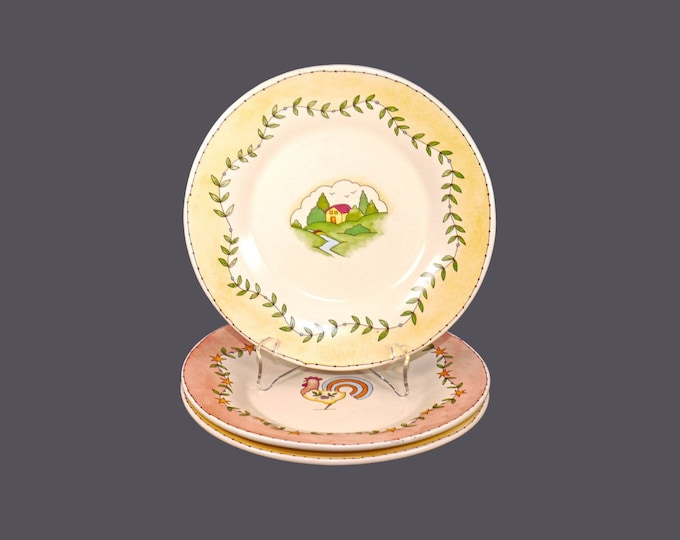 Three Russ Berrie stoneware salad plates. Rooster and cottage motifs rustic edge. Country Kitchen.