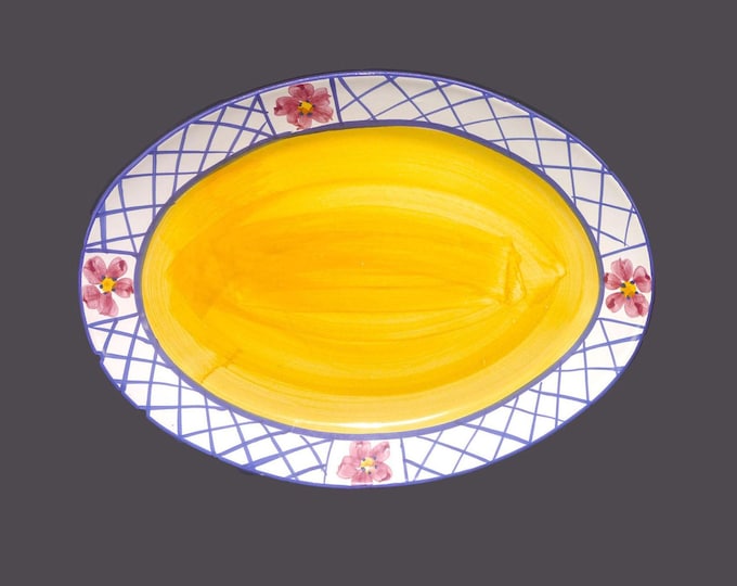 Certified International oval turkey platter made in Portugal. Blue lattice, red flowers, yellow center.