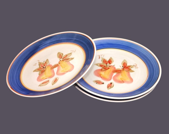 Three Gibson Designs GID333 dinner plates. Central pears, blue rims.