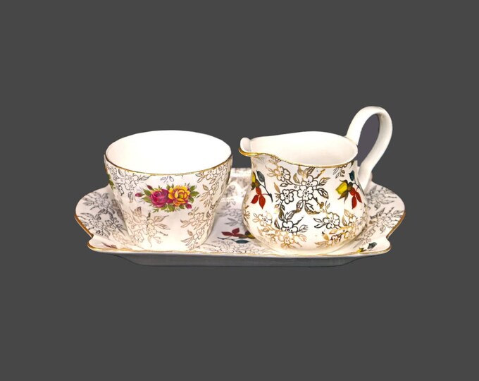 Herbert Aynsley gold floral chintz tableware: creamer, sugar bowl and under-tray made in England.