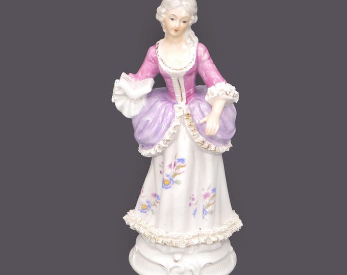 Victorian lady with book figurine made in Taiwan by CID.