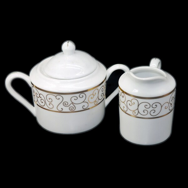 Holiday Joy Christmas creamer and covered sugar bowl set. Gold scrolls on white. Christmas tableware.