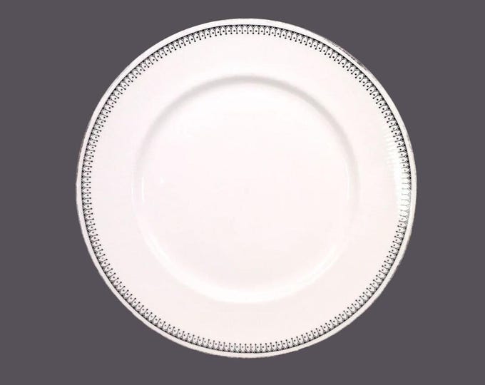 Paragon Olympus bone china dinner plate made in England. Flaw (see below). Sold individually.