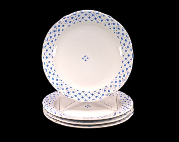 Four Royal Oak blue-and-white large dinner plates. Blue diamonds | triangles and black stars on white.