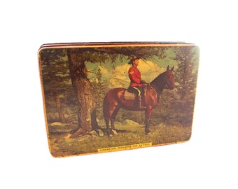 Rileys English Toffees tin. Canadian Mountie on Patrol made in England.