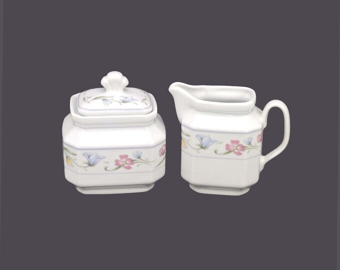 Winterling Kirchenlamitz creamer and covered sugar bowl made in Western Germany. Pink, blue, yellow flowers, gray band.