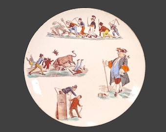 Assiette ancienne en faïence Keller Guerin de Lunéville : caricatures de Polichinelle, France
