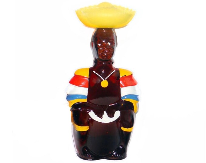 Old Oak Rum empty Limbo Drummer bottle. Original yellow plastic Sombrero lid. Made by Angostura in Trinidad.