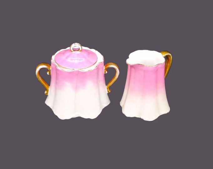Graduated pink and white creamer and covered sugar bowl set. Attributed Austria. Flaw (see below).