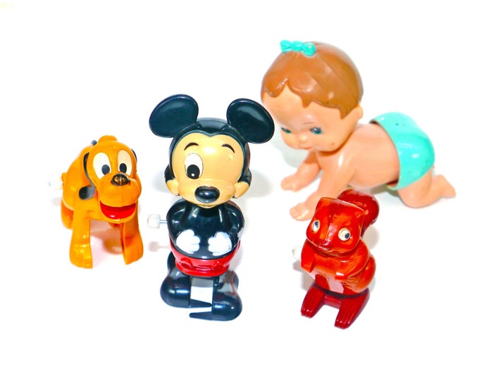 Four Walt Disney | Tomy wind-up toys made in Taiwan circa 1970s.
