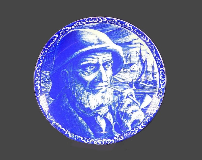 Boch La Louviere hand-painted Delft wall cabinet display plate. The Fisherman with pipe, boats in background.