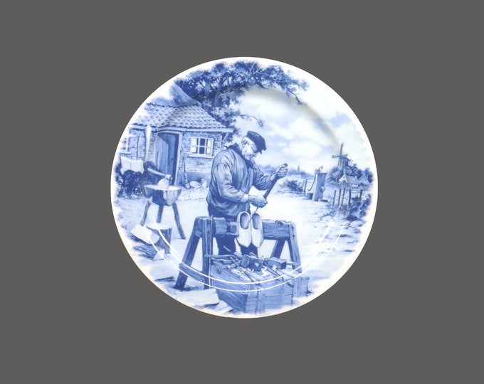 Delft Blauw blue-and-white decorative cabinet wall display plate. Dutch shoemaker making clogs. Made in Holland.