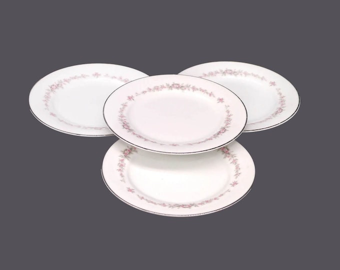 Four Noritake Rosepoint 6206 bread plates made in Japan. Small flaw (see below).