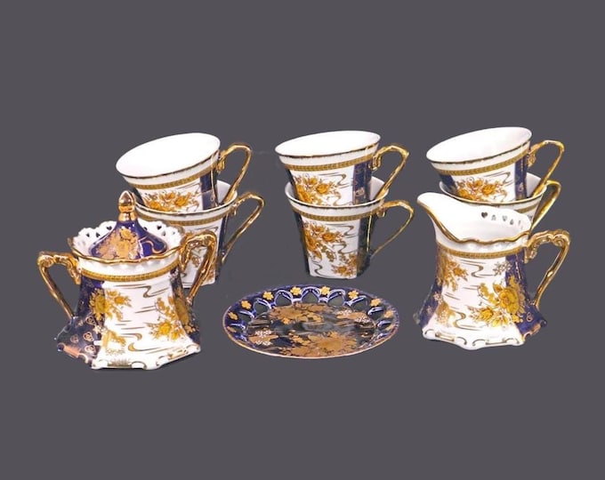 Ten pieces of Thun cobalt and gold roses tableware made in Czechoslovakia.