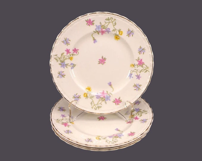 Four Myott Trouville bread plates made in England. Scalloped, gold edge. Flaw (see below).