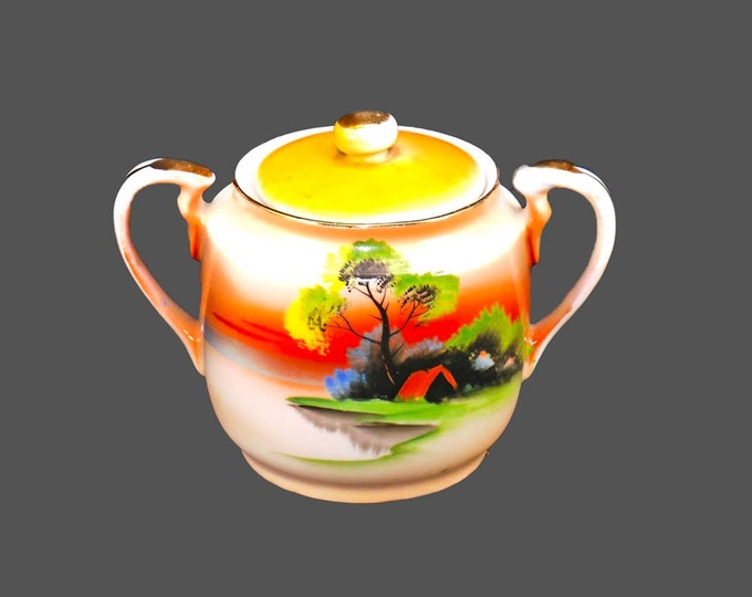 Chikaramachi hand-painted Nippon covered sugar bowl. Orange sky and cabin landscape. Small factory flaw (see below).